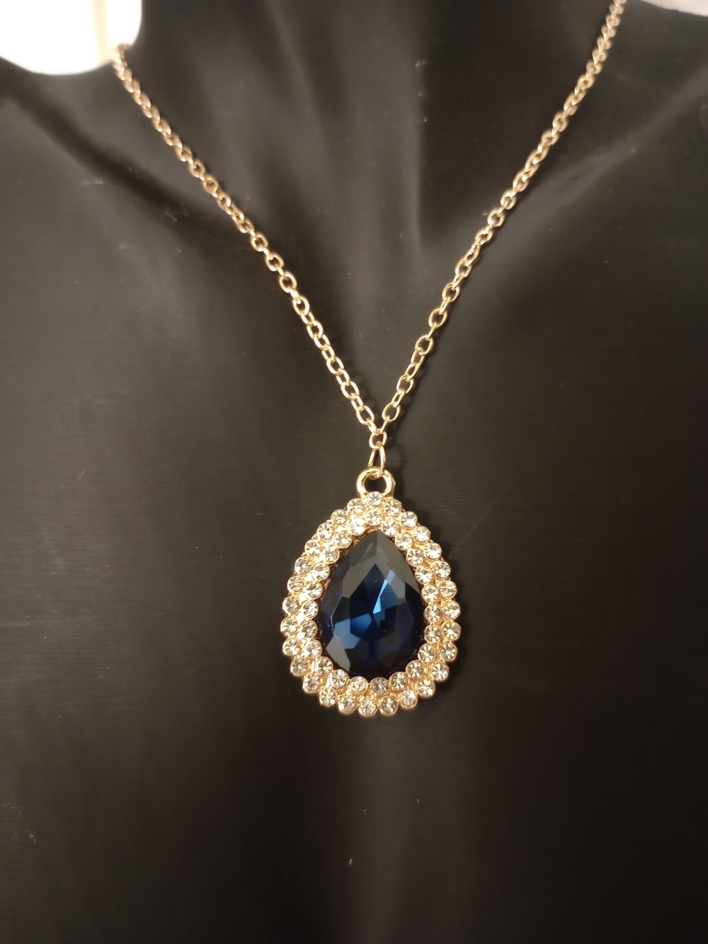 Gold Tone Teardrop Necklace with Deep Blue Crystal Pendant